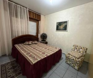 Ένα ή περισσότερα κρεβάτια σε δωμάτιο στο Quartos Praia de Itaparica