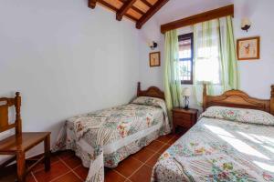 Postel nebo postele na pokoji v ubytování Vivienda Rural Atlántico Sur & Familias