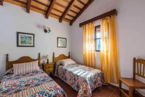 Postel nebo postele na pokoji v ubytování Vivienda Rural Atlántico Sur & Familias