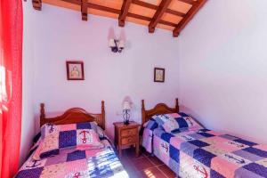 Postel nebo postele na pokoji v ubytování Vivienda Rural Atlántico Sur & Familias