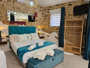 Posteľ alebo postele v izbe v ubytovaní El Edén Casas Rurales con Piscina y Jacuzzi