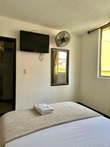 Hotel Palmeras De Mariana客房内的一张或多张床位