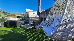Posedenie v ubytovaní El Edén Casas Rurales con Piscina y Jacuzzi