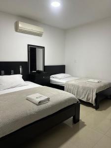 Hotel Palmeras De Mariana客房内的一张或多张床位