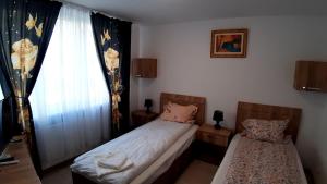 Postel nebo postele na pokoji v ubytování Acasa in Piatra Neamt