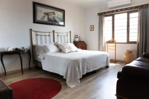 Postel nebo postele na pokoji v ubytování Hotel Don Alfonso