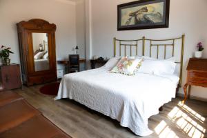 Postel nebo postele na pokoji v ubytování Hotel Don Alfonso