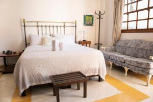 Postel nebo postele na pokoji v ubytování Hotel Don Alfonso