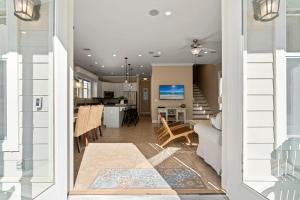a view of a living room and dining room at Seeking Sunsets 30A in Rosemary Beach