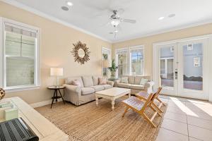 a living room with a couch and a table at Seeking Sunsets 30A in Rosemary Beach +65 photos