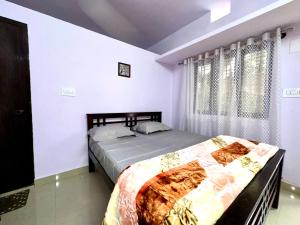 Ένα ή περισσότερα κρεβάτια σε δωμάτιο στο Dream Garden Homestay