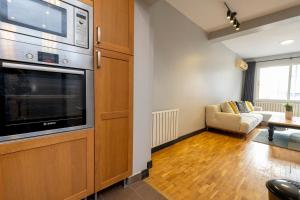 a living room with a large television and a couch at Private Fourlex House with Central Location in Istanbul