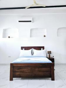 Ένα ή περισσότερα κρεβάτια σε δωμάτιο στο Hello Rafiki House - Stonetown