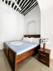 Ένα ή περισσότερα κρεβάτια σε δωμάτιο στο Hello Rafiki House - Stonetown