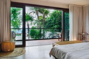 Cama ou camas em um quarto em Mi Amor Tulum, a Small Luxury Hotel mais 37 fotos