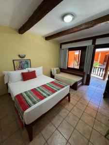 Cama ou camas em um quarto em Pousada Tambayba