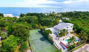an aerial view of a house with a tennis court at Tangerine Sunsets Alta Vista Studio One in Nassau