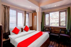 Postel nebo postele na pokoji v ubytování Hotel O Avigna Residency