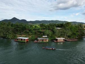 a group of boats in the water on a river at Vangngo View Resort, Muang Fuang in Muang Fuang +13 photos