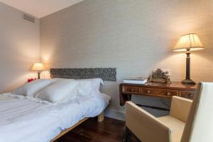 Ένα ή περισσότερα κρεβάτια σε δωμάτιο στο By Plaza de España overlooking Parque María Luisa