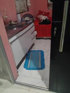 a small kitchen with a sink and a counter at Casa da vovó Alessandra in Belém