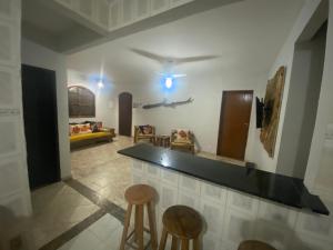 a bar in a room with two stools at Refúgio Eucalipto in Miguel Pereira +38 photos