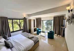Postel nebo postele na pokoji v ubytování Veu Munnar Retreat - Valley View Rooms + 17 fotografií