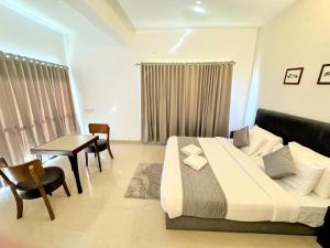 Postel nebo postele na pokoji v ubytování Veu Munnar Retreat - Valley View Rooms