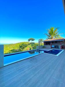 a swimming pool on the roof of a house at Recanto sol nascente in Rio Formoso