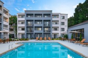 an image of a hotel with a swimming pool at Courtyard by Marriott Perimeter Center in Atlanta