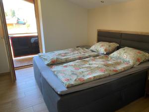 Posteľ alebo postele v izbe v ubytovaní Residenz am Erzbach Top 2A