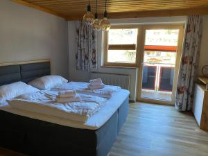 Posteľ alebo postele v izbe v ubytovaní Residenz am Erzbach Top 2A