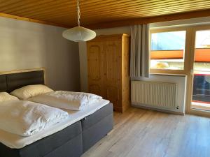 Posteľ alebo postele v izbe v ubytovaní Residenz am Erzbach Top 2A