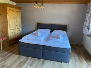 Posteľ alebo postele v izbe v ubytovaní Residenz am Erzbach Top 2A