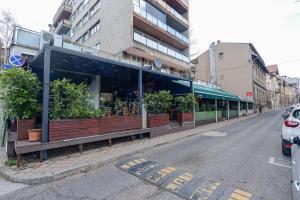a restaurant on the side of a street at Luxury House Sarajevo Center in Sarajevo