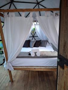 Postel nebo postele na pokoji v ubytování Glamping Paraiso