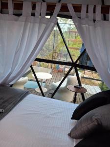 Postel nebo postele na pokoji v ubytování Glamping Paraiso