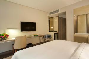 เตียงในห้องที่ Venit Barra Hotel