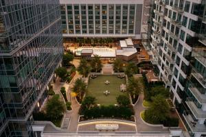 an aerial view of a courtyard between two tall buildings at Epicurean Atlanta, Autograph Collection in Atlanta