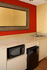 a kitchen with a sink and a microwave at Courtyard by Marriott Baltimore Downtown Inner Harbor in Baltimore +16 photos