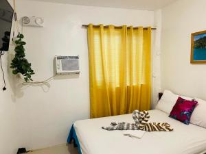 Postel nebo postele na pokoji v ubytování Siargao Zita's Garden Inn