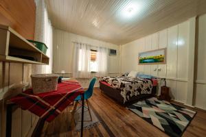 Ένα ή περισσότερα κρεβάτια σε δωμάτιο στο Rancho Vô João - Espaço para Momentos Incríveis