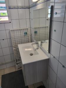 Koupelna v ubytování Appartement avec piscine