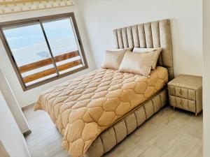 Postel nebo postele na pokoji v ubytování Appartements face a la mer