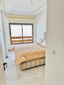 Voodi või voodid majutusasutuse Appartements face a la mer toas