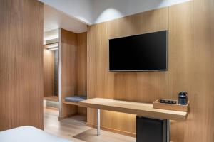 TV a/nebo společenská místnost v ubytování AC Hotel Diagonal L'Illa by Marriott