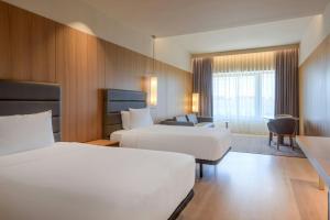 Postel nebo postele na pokoji v ubytování AC Hotel Diagonal L'Illa by Marriott
