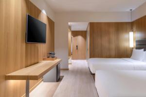 Postel nebo postele na pokoji v ubytování AC Hotel Diagonal L'Illa by Marriott