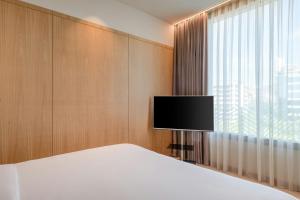 TV a/nebo společenská místnost v ubytování AC Hotel Diagonal L'Illa by Marriott