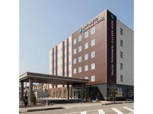 a large building with a sign on the side of it at New Matto Terminal Hotel - Vacation STAY 01878v in Hakusan +10 photos